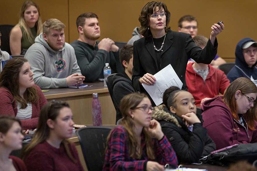 Lecturer Tammy French teaching students in Hyland Hall.