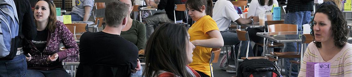 Dean of Students with students talking at University Center